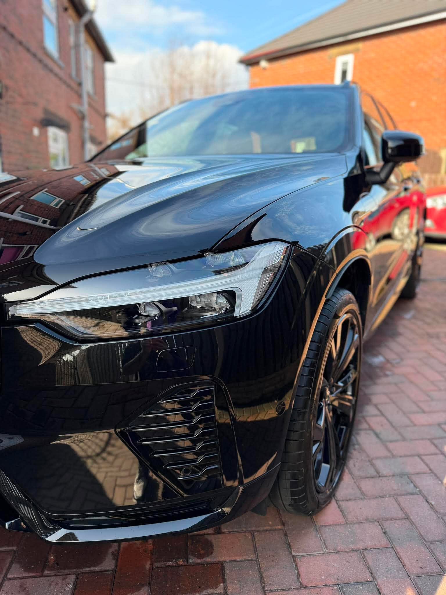 Black Volvo after a gloss-focused exterior detail