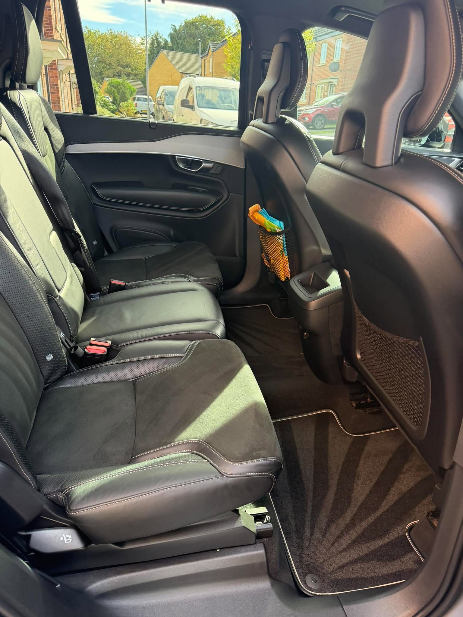 Clean black leather interior of a Volvo XC90 after detailing