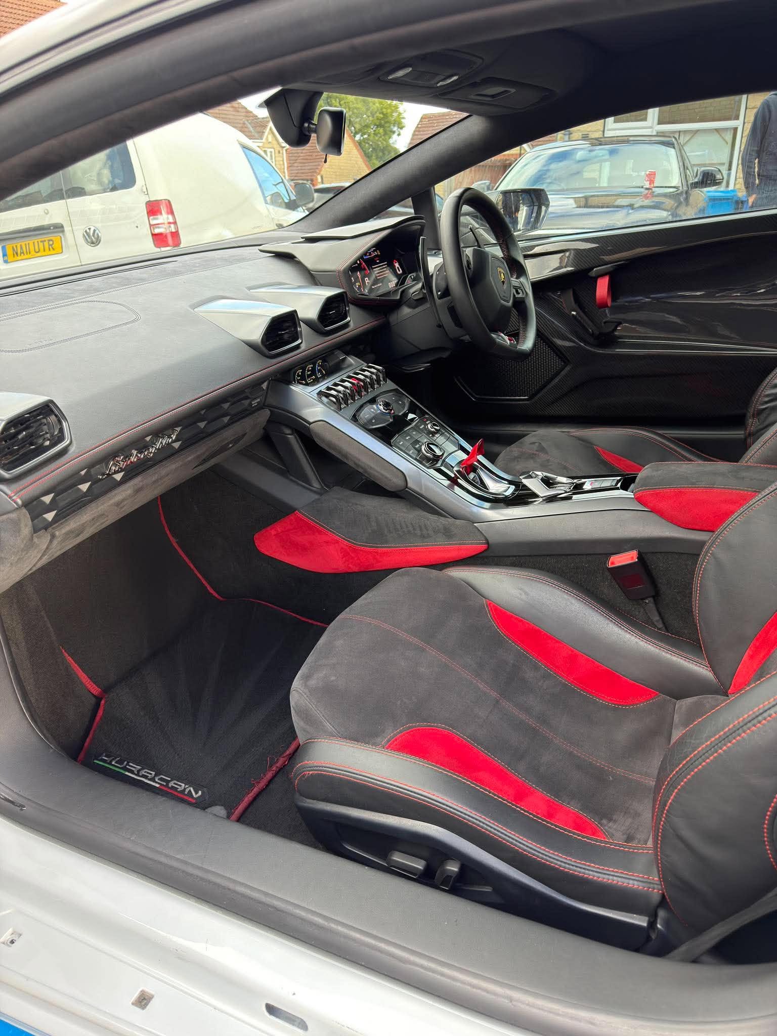 Black and red Lamborghini Huracán STO interior after detailing by Detail Society